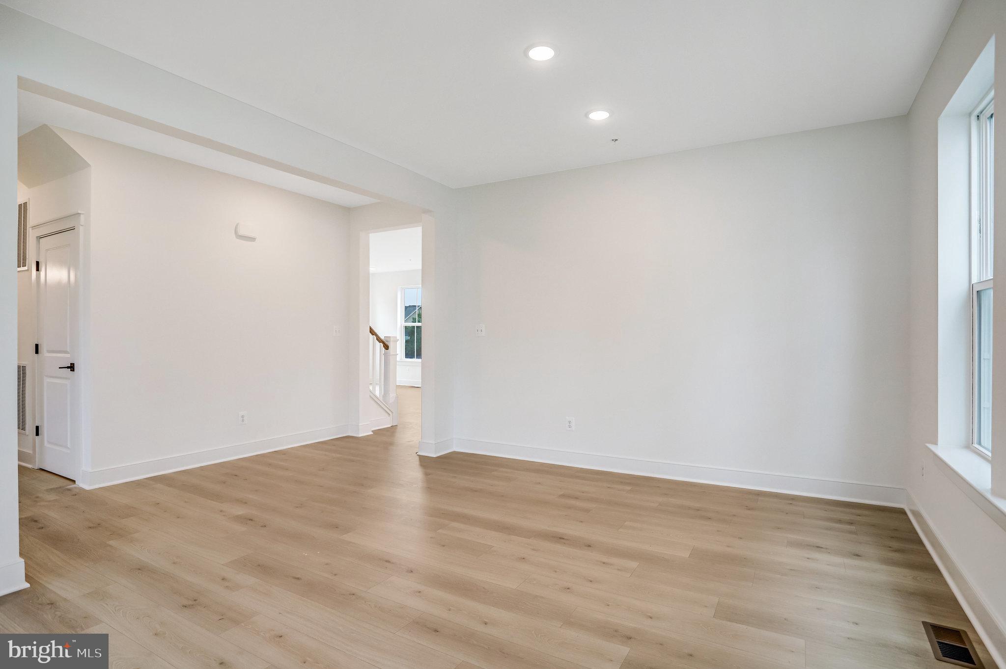 2734 Tuscarora Road Adamstown, MD 21710 - Photo 22 of 85 an empty room with wooden floor and windows