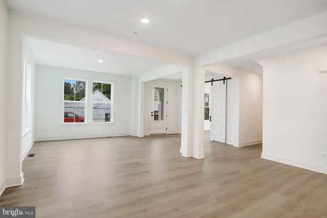 a view of kitchen with wooden floor and electronic appliances