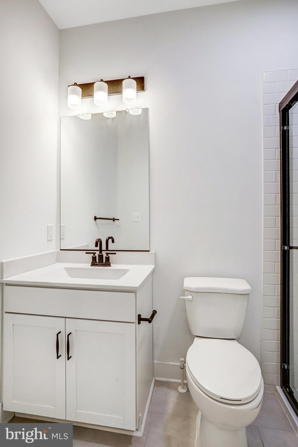 2734 Tuscarora Road Adamstown, MD 21710 - Photo 42 of 85 a bathroom with a sink a toilet and mirror