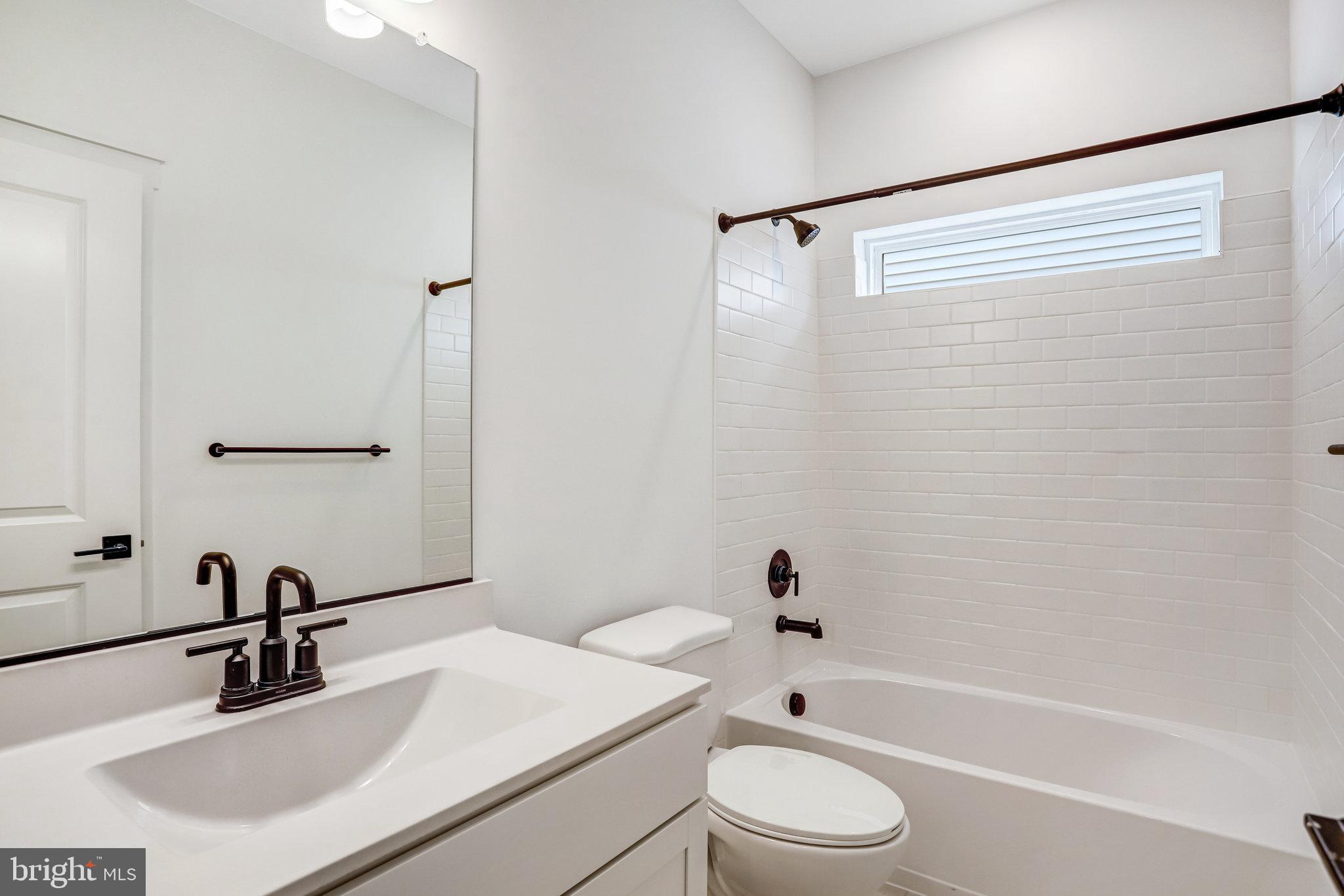 2734 Tuscarora Road Adamstown, MD 21710 - Photo 53 of 85 a bathroom with a sink a toilet and a bathtub