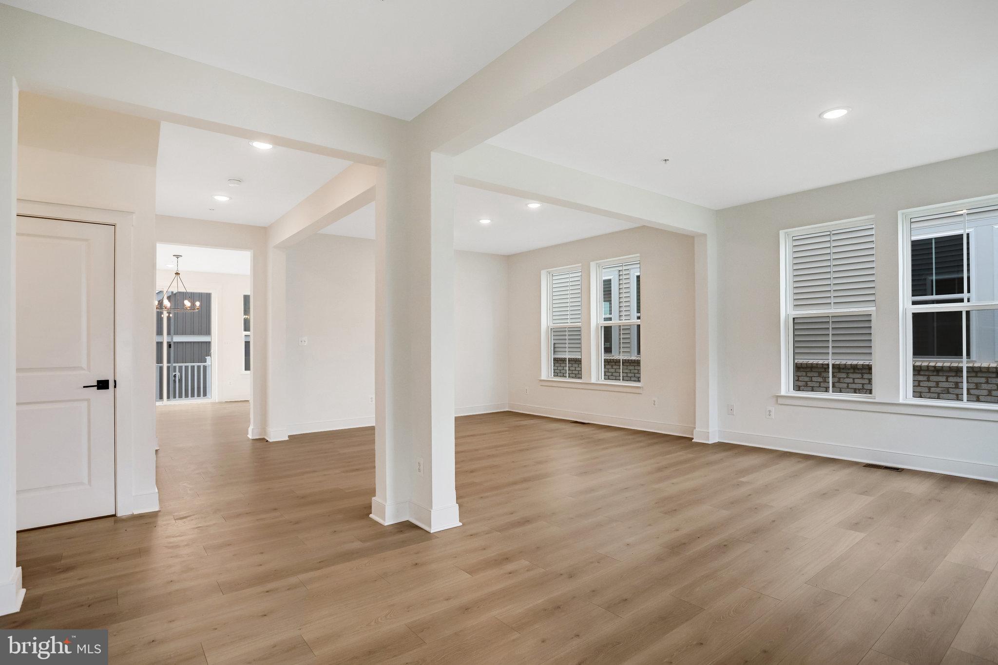 2734 Tuscarora Road Adamstown, MD 21710 - Photo 7 of 85 a view of an empty room with wooden floor and windows