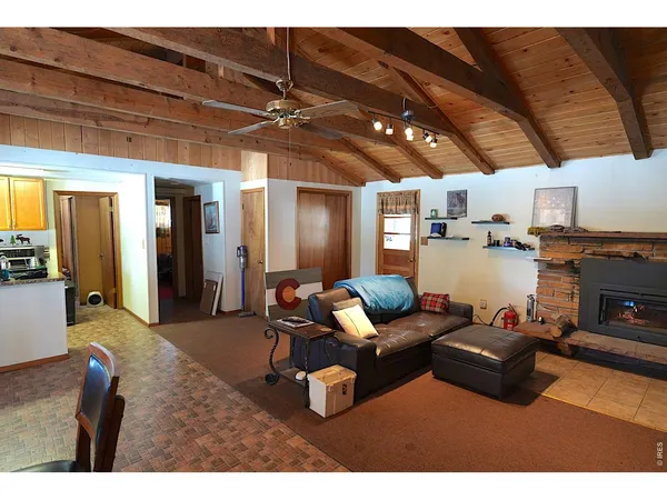 a kitchen with sink refrigerator and window
