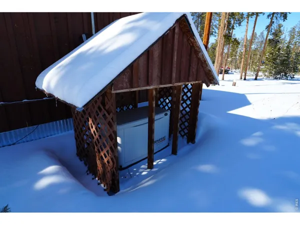 a view of an entryway door with wooden floor