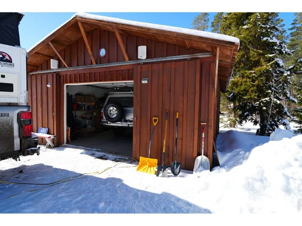 a view of a patio with table and chairs and potted plants