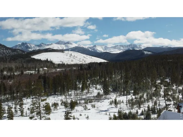 a living room with furniture a window and gym equipment
