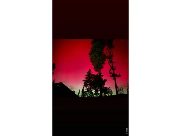 a view of a livingroom with furniture and a flat screen tv