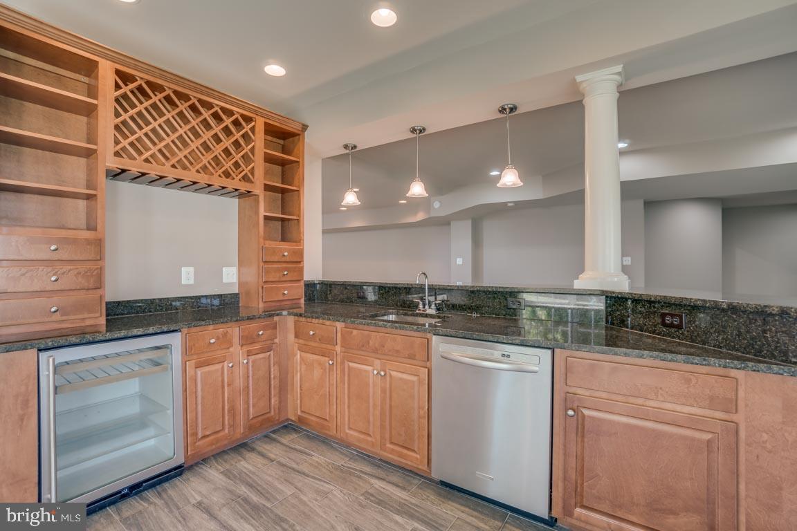 18460 Kerill Road Triangle, VA 22172 - Photo 37 of 47 Wet bar in basement with dish washer and wine frig