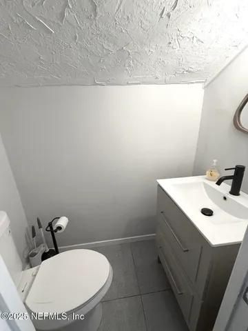 a view of a porch with wooden floor and furniture