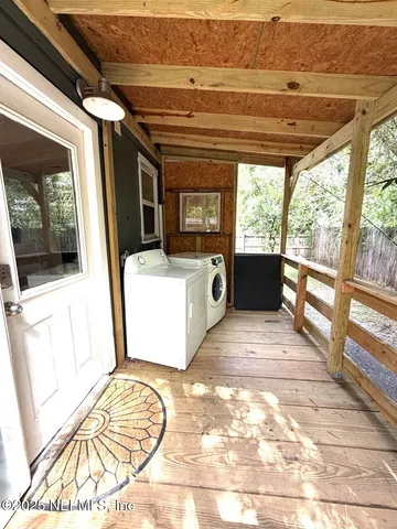 a backyard of a house with yard and outdoor seating