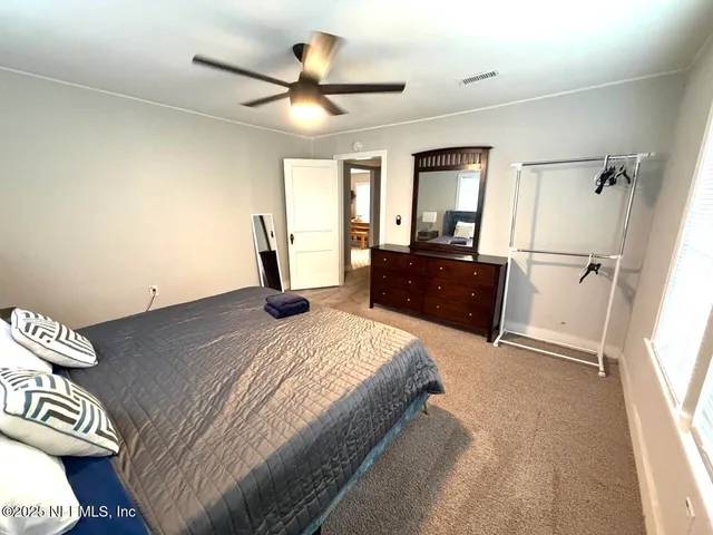 a bathroom with a sink toilet and a mirror