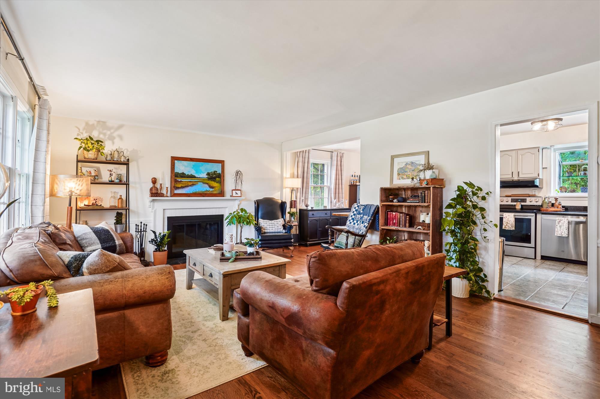 6108 Dorchester Street Springfield, VA 22150 - Photo 3 of 20 a living room with furniture a fireplace and a window