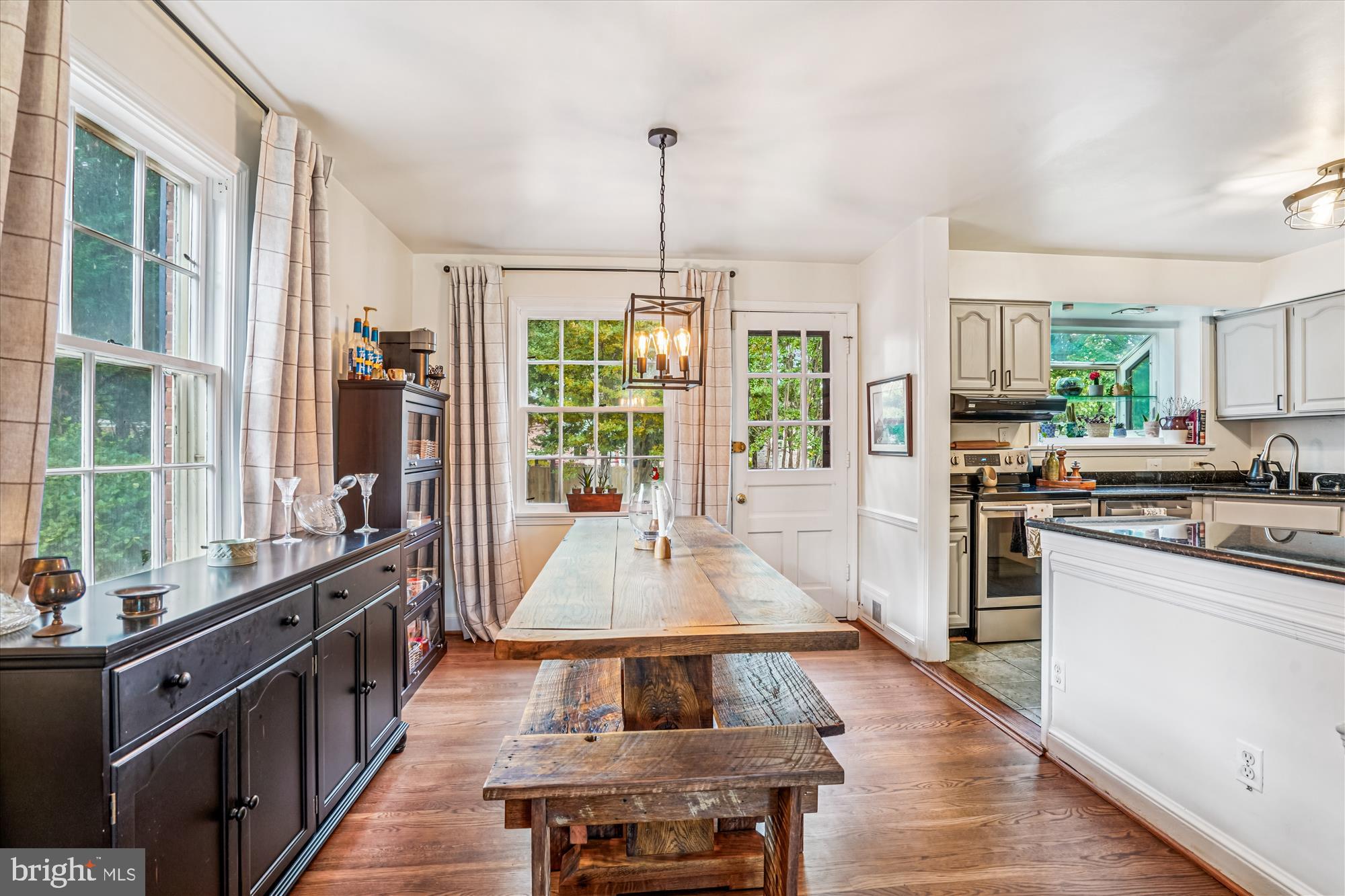 6108 Dorchester Street Springfield, VA 22150 - Photo 4 of 20 a large kitchen with kitchen island a large window in it