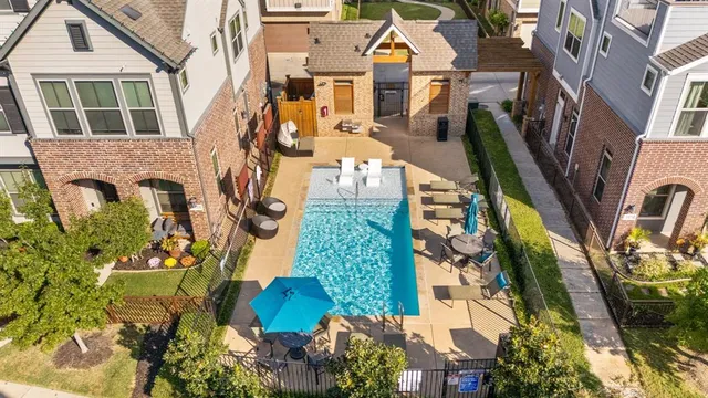 an aerial view of residential houses with outdoor space