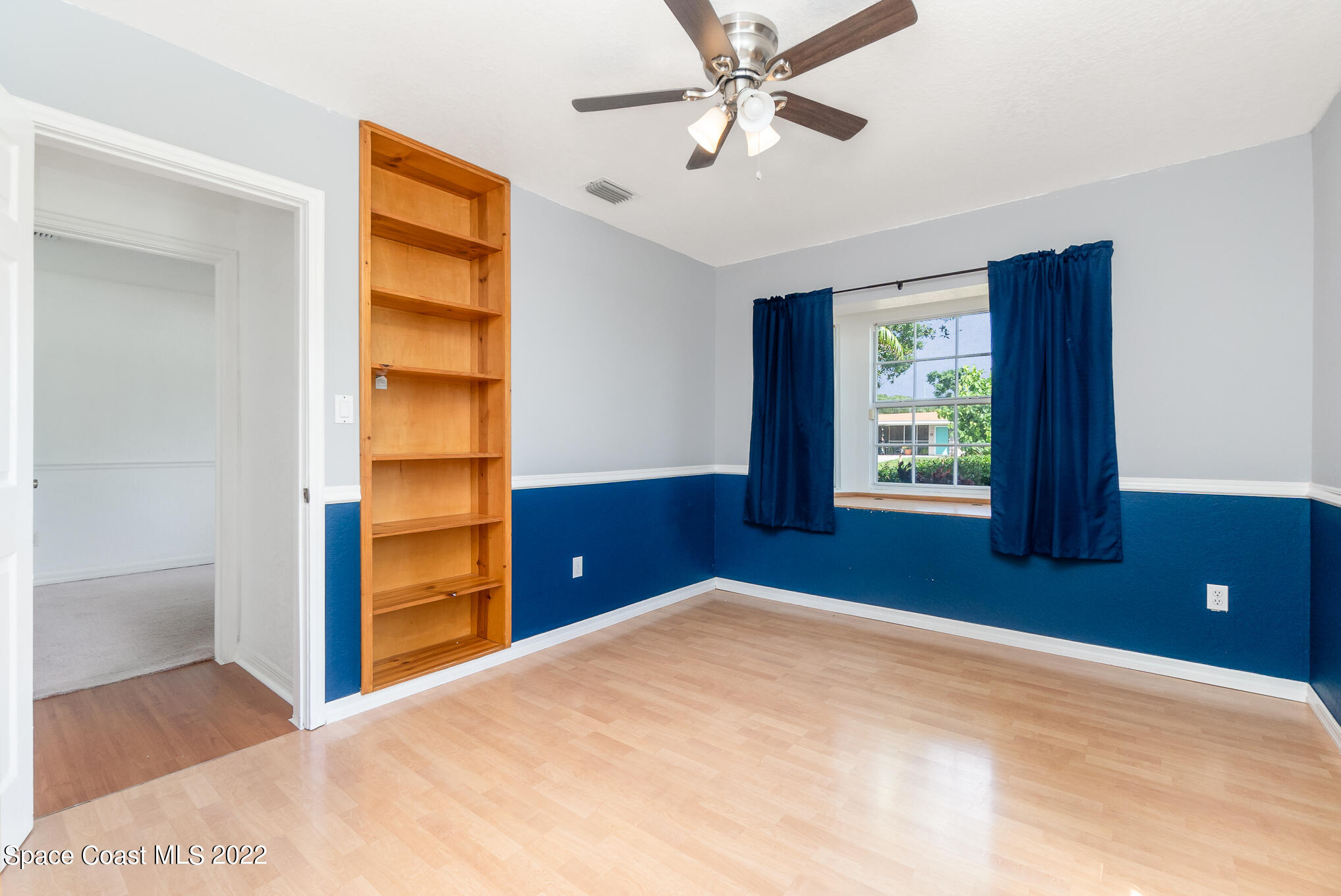 201 Orchid Boulevard Melbourne, FL 32901 - Photo 12 of 36 a bedroom with a bed and a window