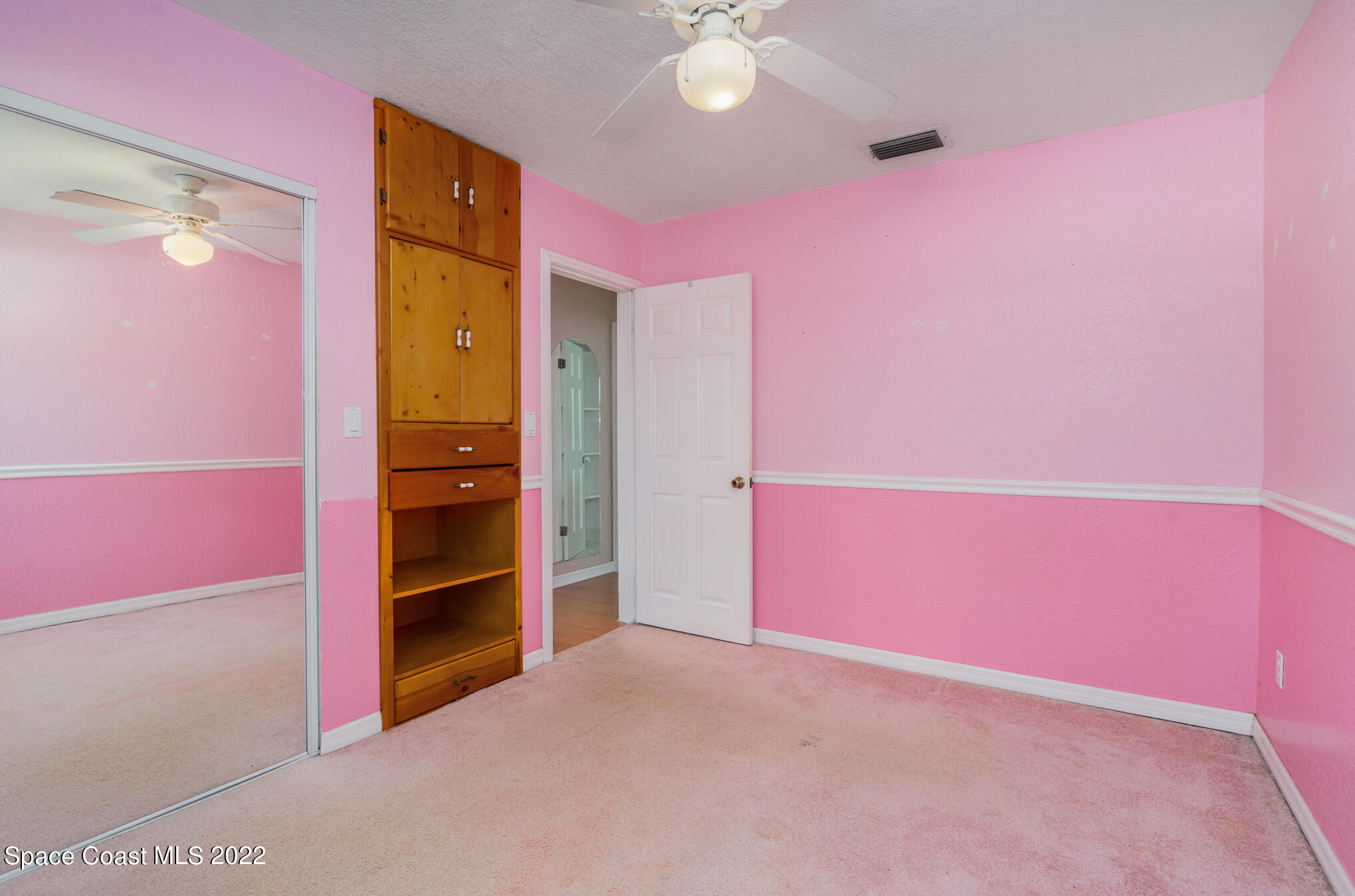 201 Orchid Boulevard Melbourne, FL 32901 - Photo 16 of 36 an empty room with a kitchen