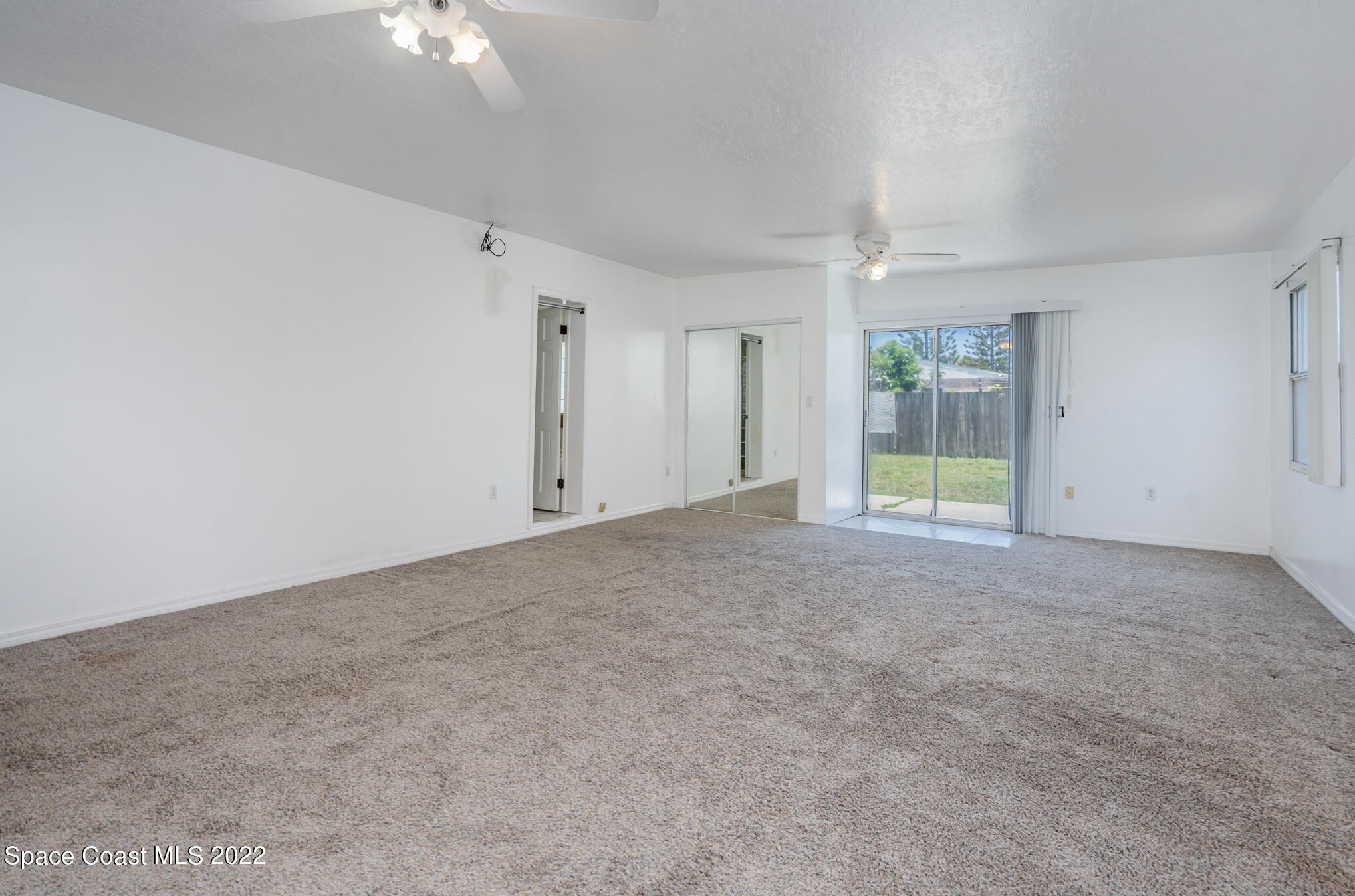 201 Orchid Boulevard Melbourne, FL 32901 - Photo 20 of 36 an empty room with a empty space and a ceiling fan