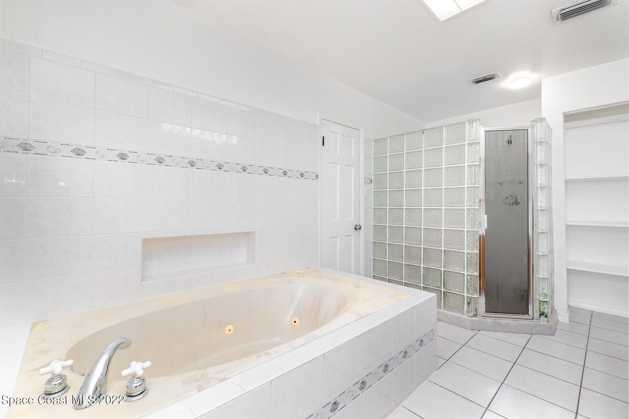 201 Orchid Boulevard Melbourne, FL 32901 - Photo 25 of 36 a bathroom with a bathtub and shower