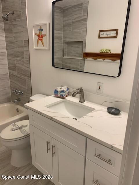 201 Orchid Boulevard Melbourne, FL 32901 - Photo 30 of 36 a bathroom with a sink and a mirror
