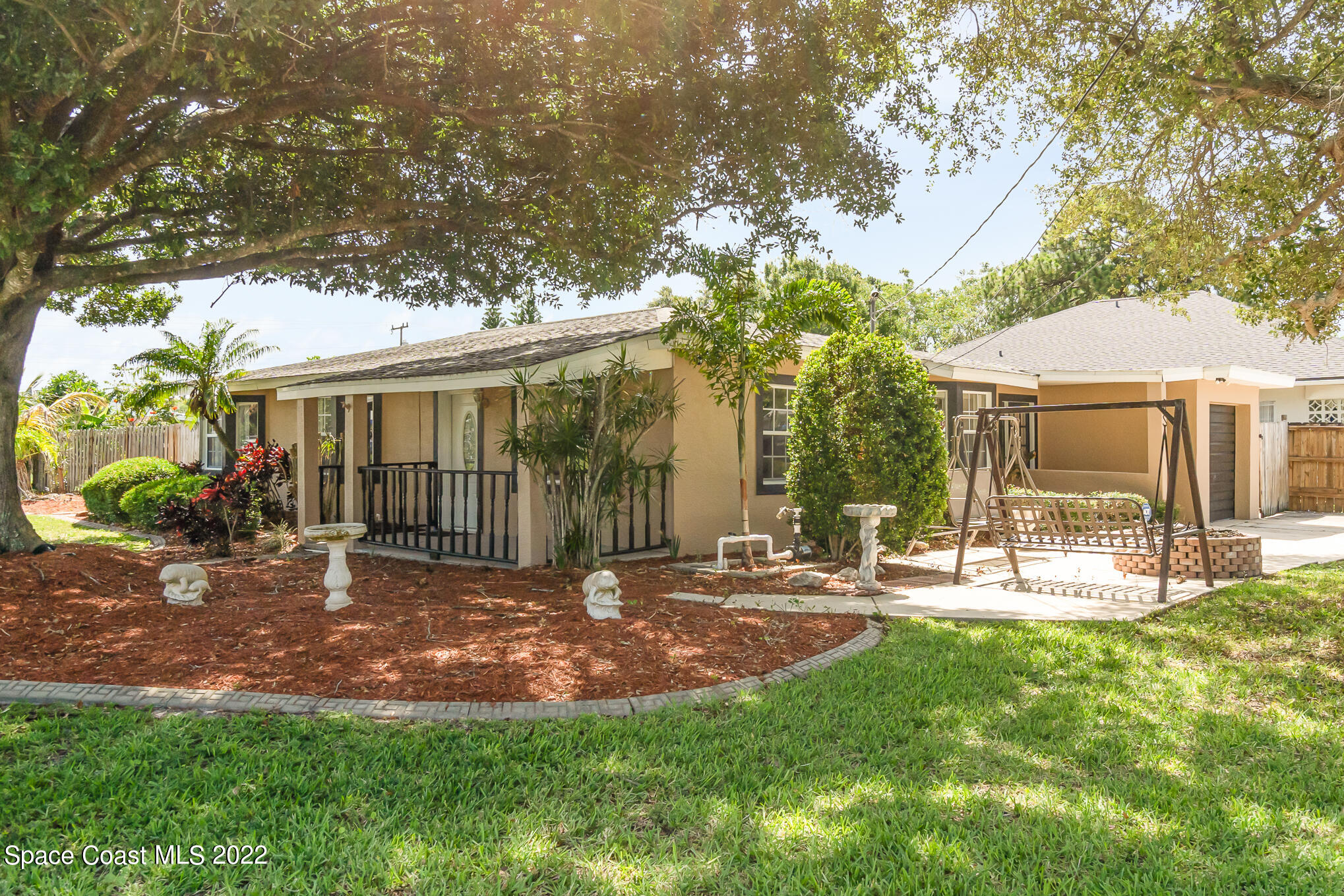 201 Orchid Boulevard Melbourne, FL 32901 - Photo 3 of 36 a view of a house with backyard and sitting area