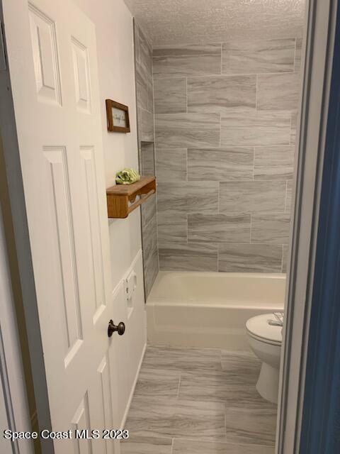 201 Orchid Boulevard Melbourne, FL 32901 - Photo 32 of 36 a bathroom with a bathtub and a shower
