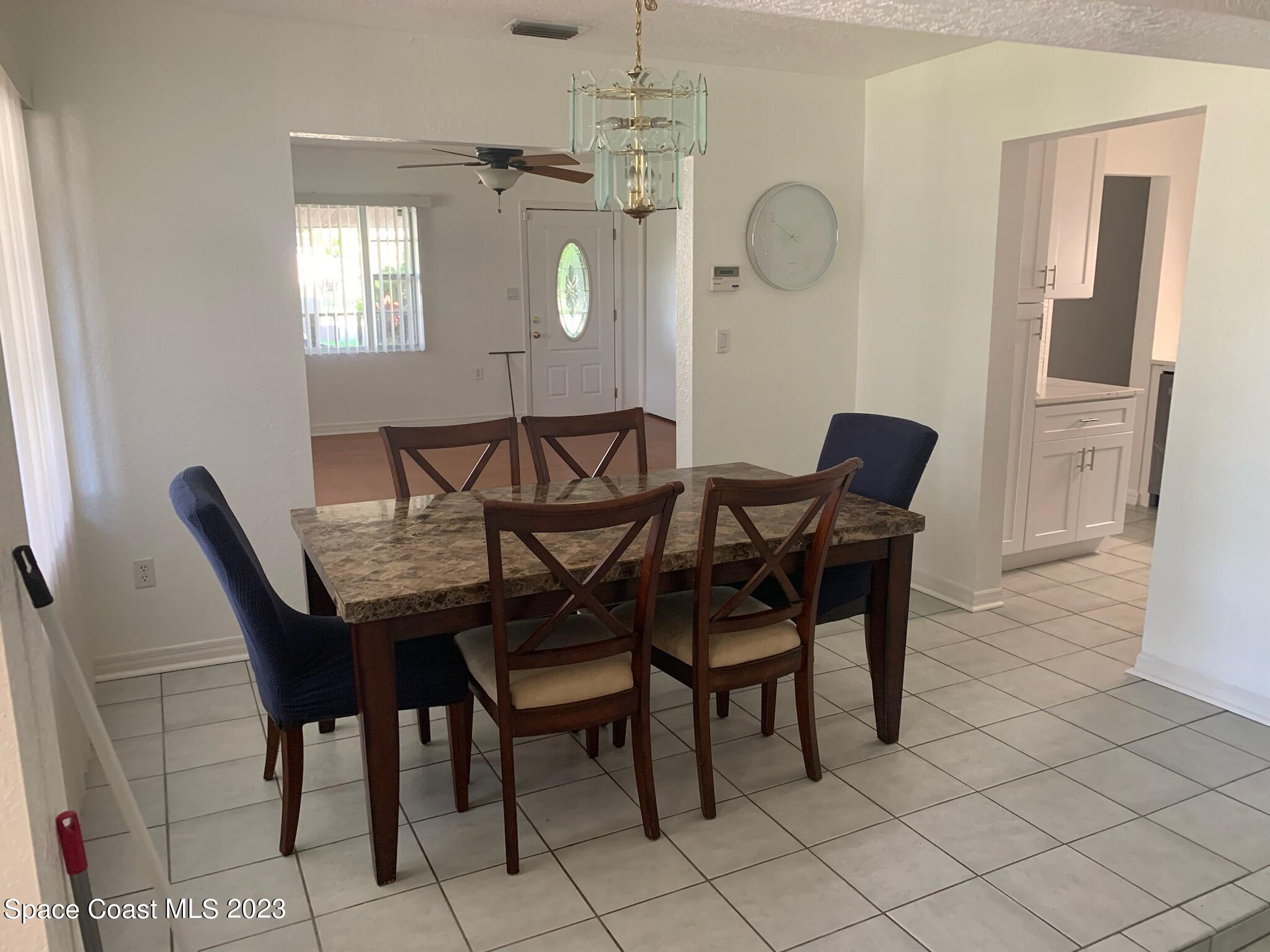 201 Orchid Boulevard Melbourne, FL 32901 - Photo 7 of 36 a view of a dining room with furniture and window