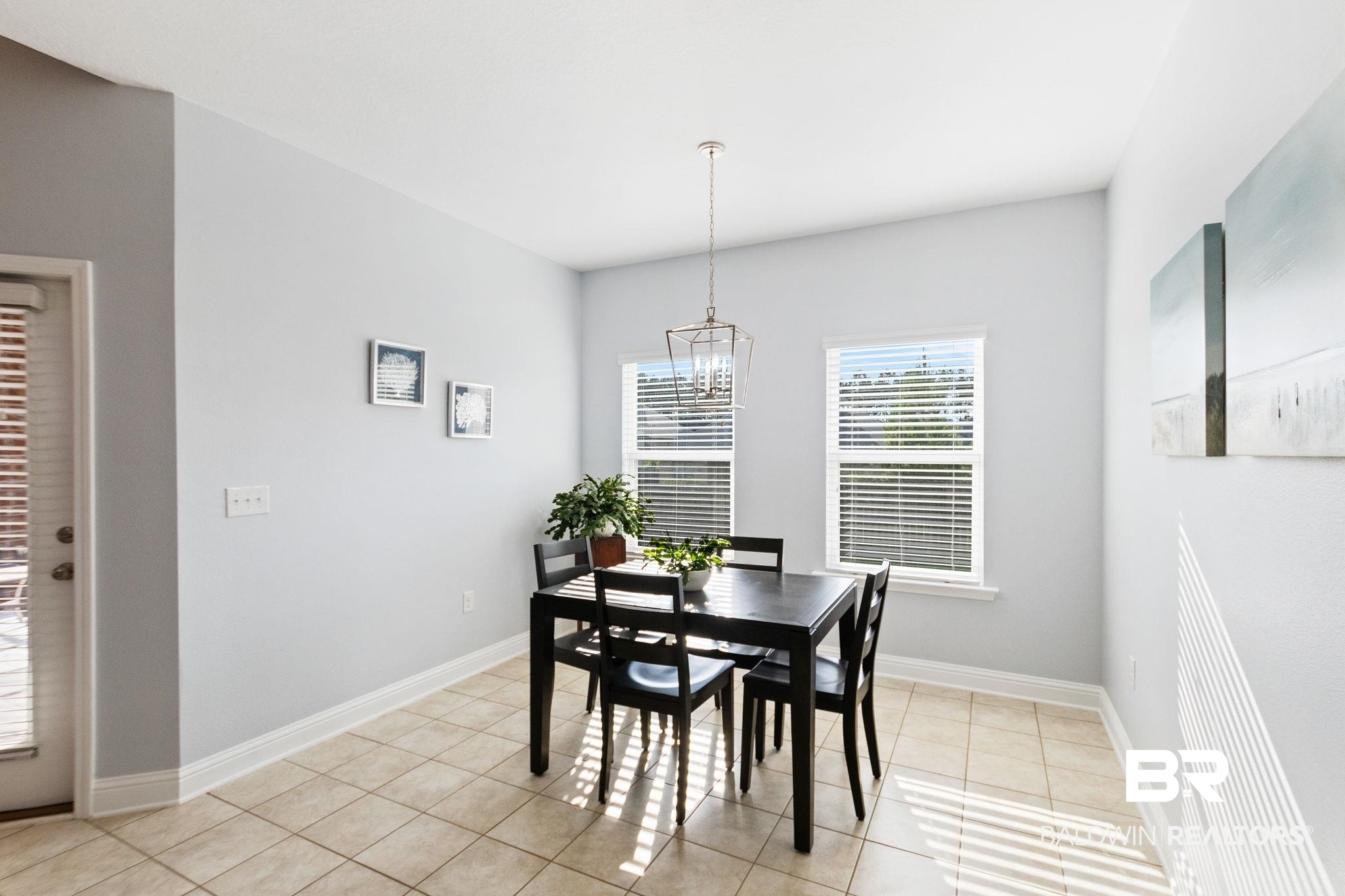 31541 Hoot Owl Road Daphne, AL 36527 - Photo 18 of 51 Dining area with an inviting chandelier and light tile patterned floors