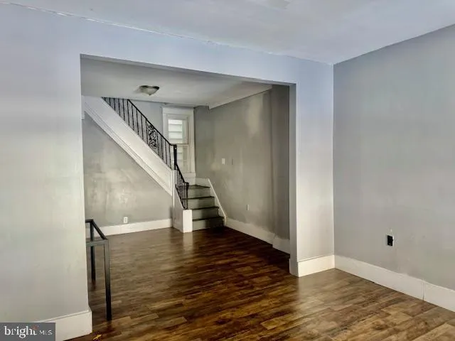 a view of entryway with wooden floor