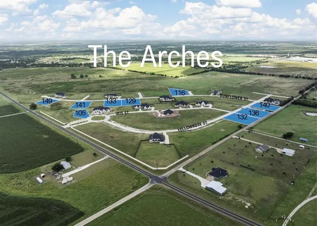 a view of a pool with lawn chairs