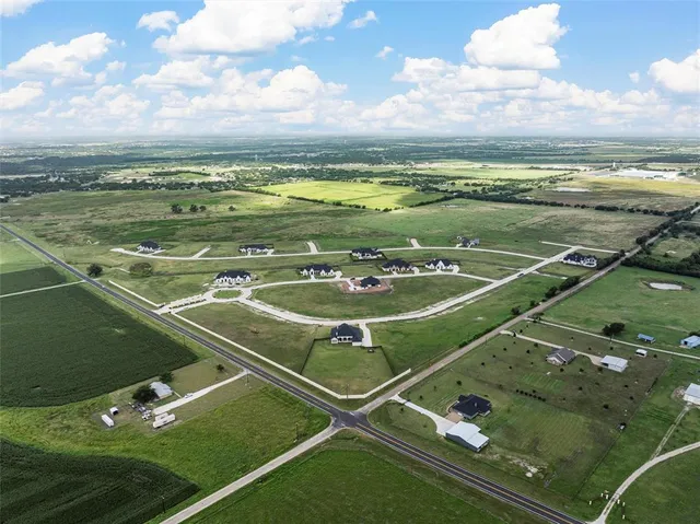 a view of a pool table and chairs