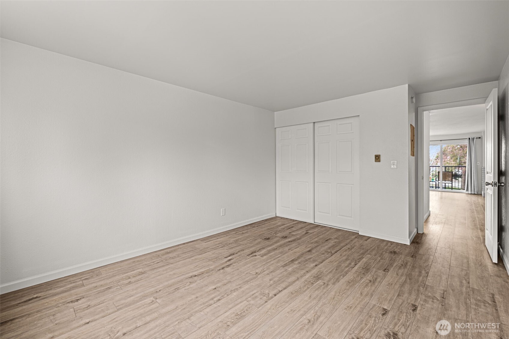15210 Macadam Road South, Unit D211 Tukwila, WA 98188 - Photo 11 of 26 a view of a room with wooden floor