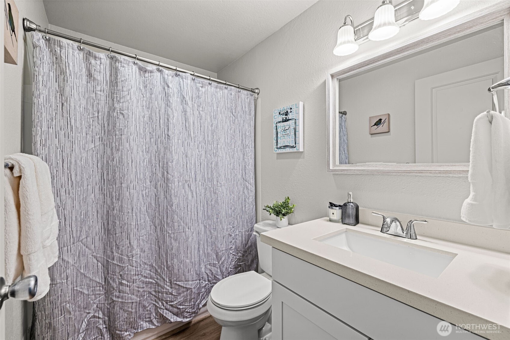 15210 Macadam Road South, Unit D211 Tukwila, WA 98188 - Photo 12 of 26 a bathroom with a granite countertop sink toilet and a mirror