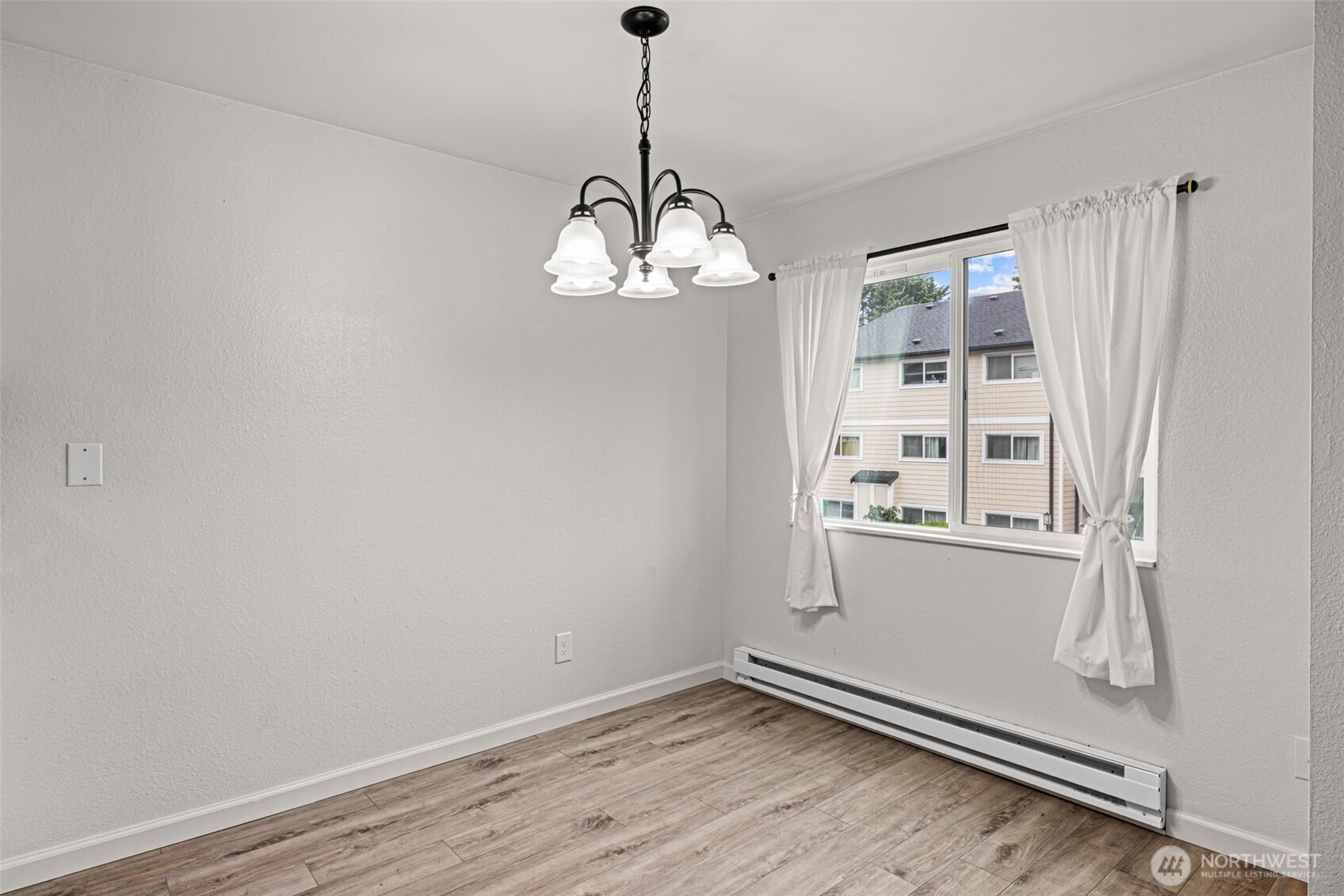 15210 Macadam Road South, Unit D211 Tukwila, WA 98188 - Photo 16 of 26 a view of an empty room with a window