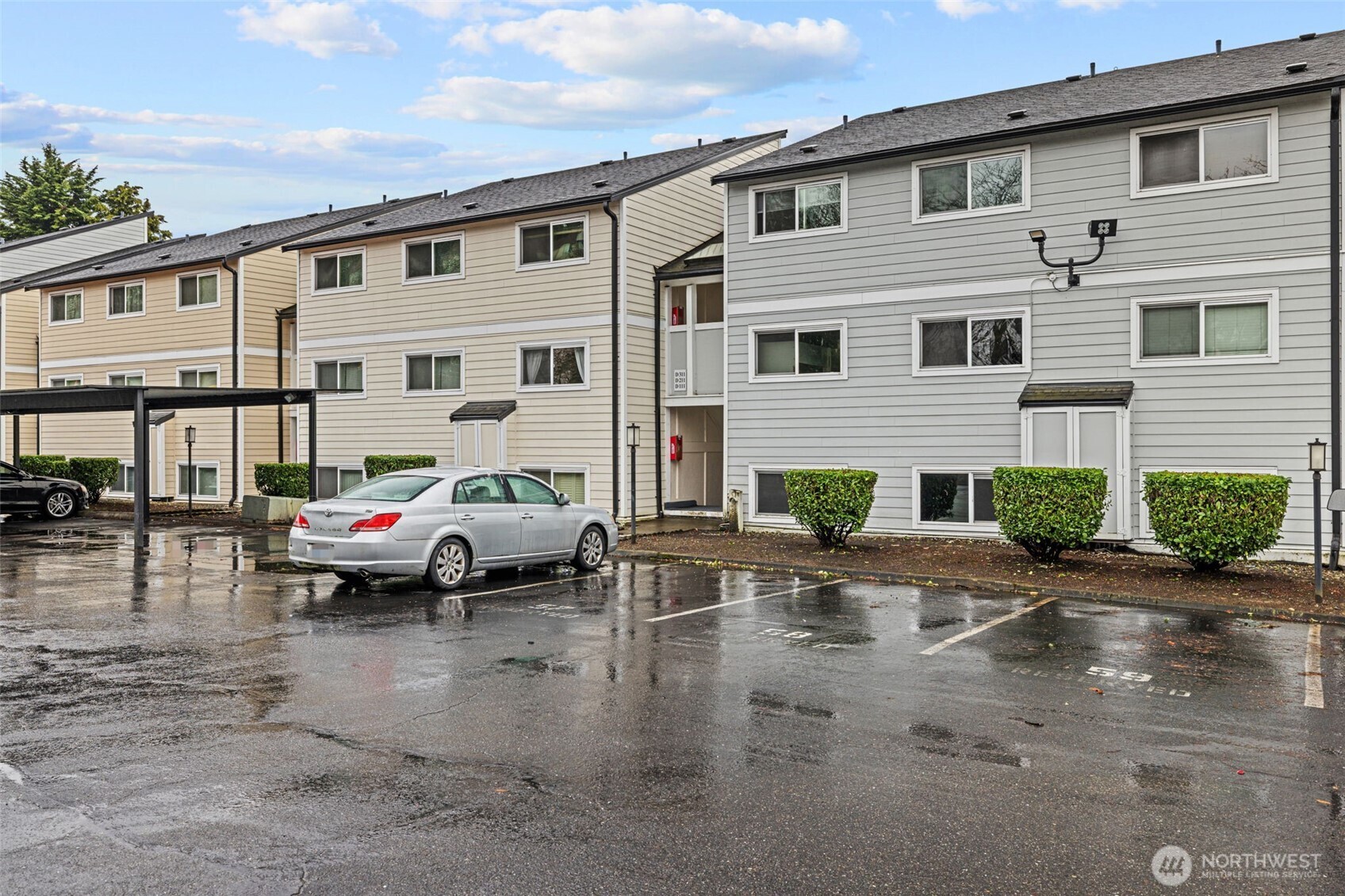 15210 Macadam Road South, Unit D211 Tukwila, WA 98188 - Photo 26 of 26 a couple of cars parked in front of a house