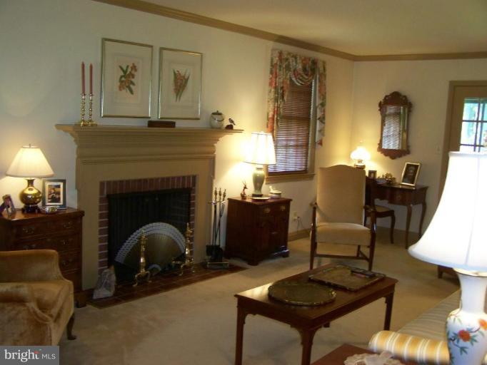 607 Coventry Road Towson, MD 21286 - Photo 2 of 19 a living room with furniture and a fireplace