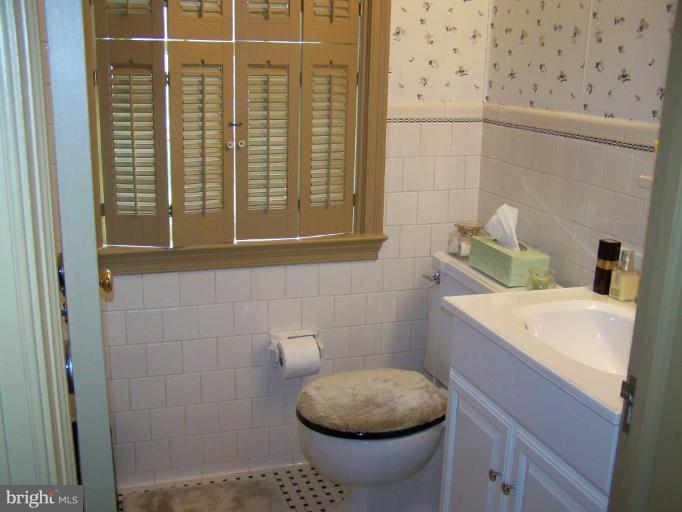 607 Coventry Road Towson, MD 21286 - Photo 15 of 19 a bathroom with a toilet and a sink
