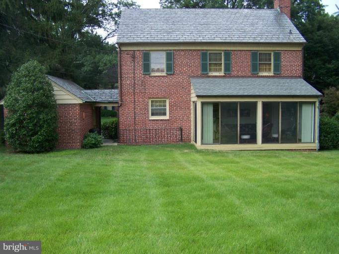 607 Coventry Road Towson, MD 21286 - Photo 17 of 19 a view of a brick house and a yard