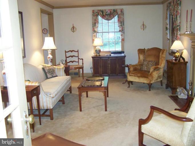 607 Coventry Road Towson, MD 21286 - Photo 3 of 19 a living room with furniture and a window