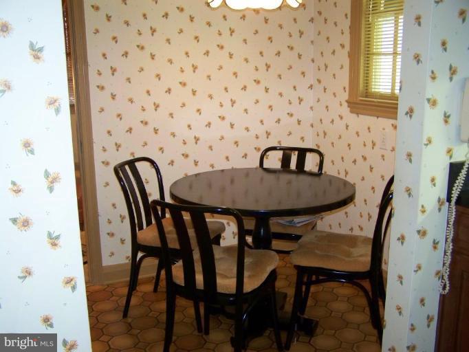 607 Coventry Road Towson, MD 21286 - Photo 9 of 19 a view of a dining room with furniture and window