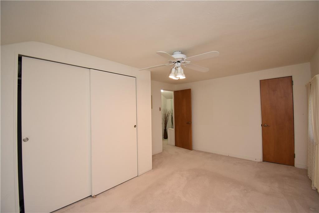 802 Dunster Street Pittsburgh, PA 15226 - Photo 15 of 22 a view of an empty room with a chandelier fan