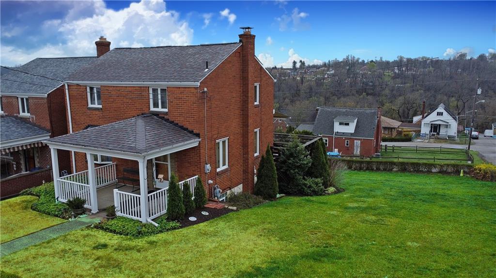 802 Dunster Street Pittsburgh, PA 15226 - Photo 3 of 22 a aerial view of a house with a big yard and large trees