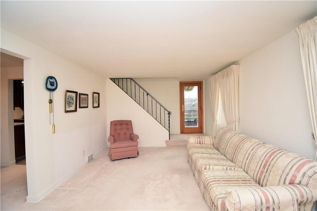 802 Dunster Street Pittsburgh, PA 15226 - Photo 10 of 22 a living room with furniture and stairs