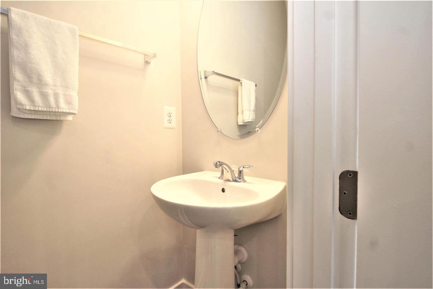 2471 Liberty Loop Herndon, VA 20171 - Photo 11 of 35 a bathroom with a sink and a mirror