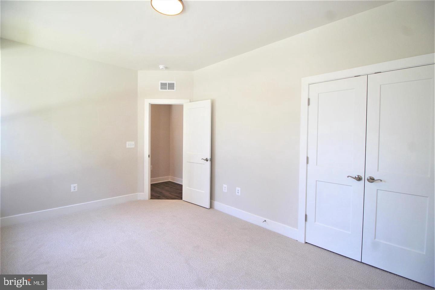 2471 Liberty Loop Herndon, VA 20171 - Photo 18 of 35 an empty room with closet and a window
