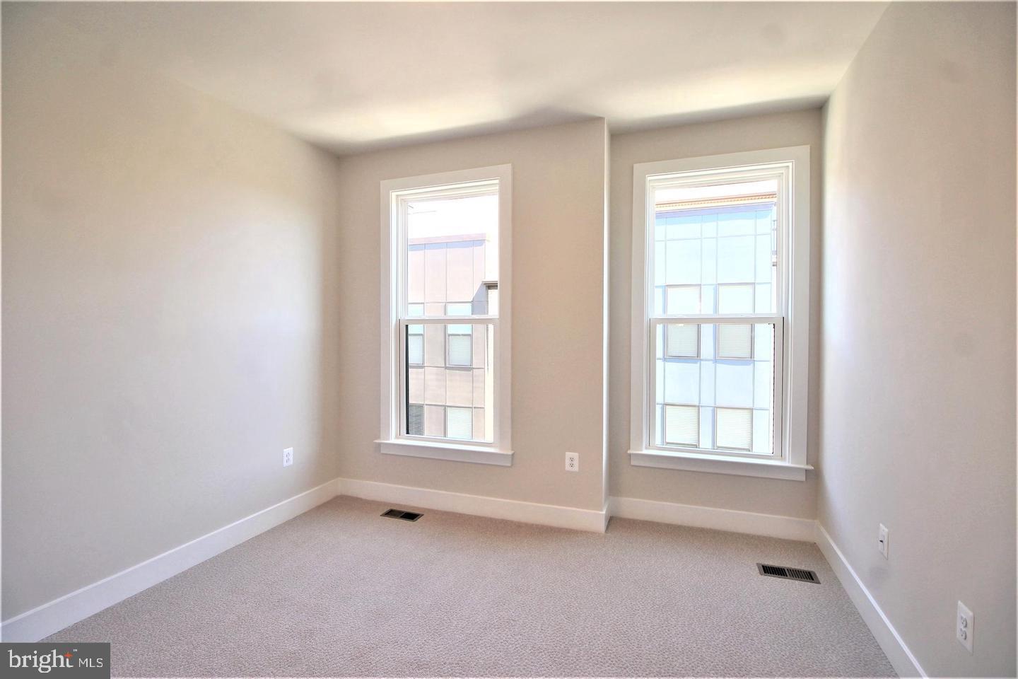 2471 Liberty Loop Herndon, VA 20171 - Photo 24 of 35 an empty room with windows and closet