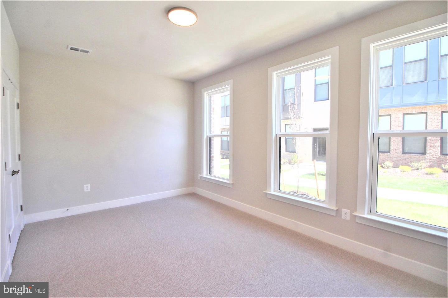 2471 Liberty Loop Herndon, VA 20171 - Photo 7 of 35 an empty room with a window