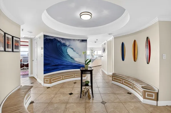 a view of a hallway with entryway wooden floor and front door