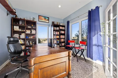 a view of a dining room with furniture window and outside view