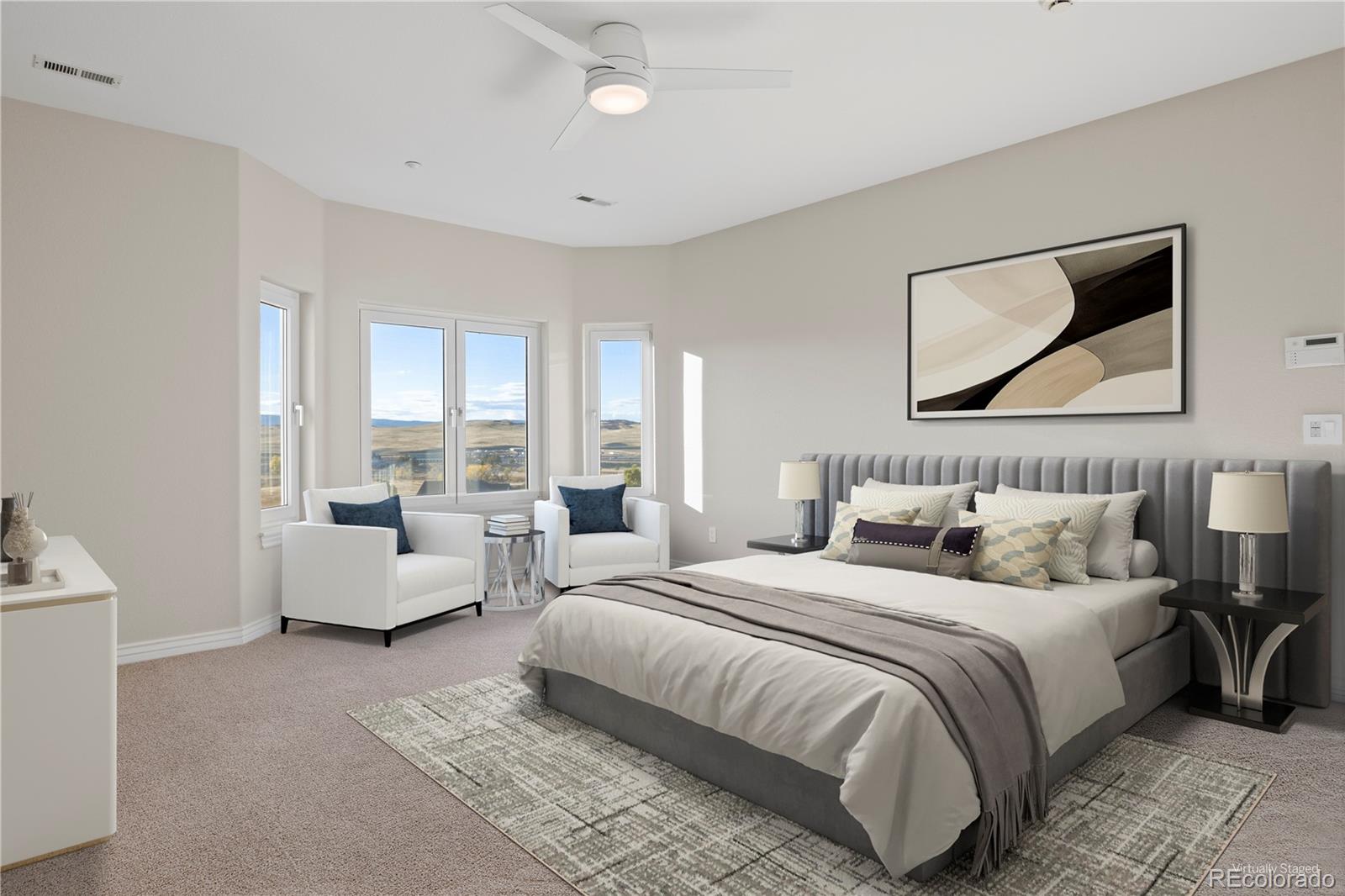 3532 Bell Mountain Drive Castle Rock, CO 80104 - Photo 22 of 50 a bedroom with bed couches and white walls