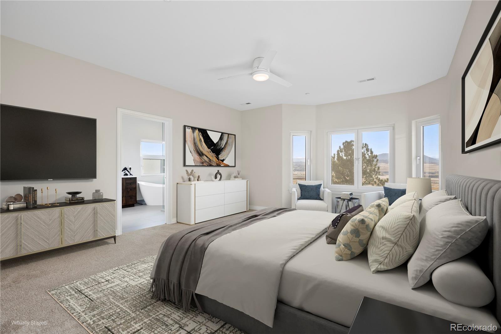 3532 Bell Mountain Drive Castle Rock, CO 80104 - Photo 23 of 50 a bedroom with bed and a flat screen tv