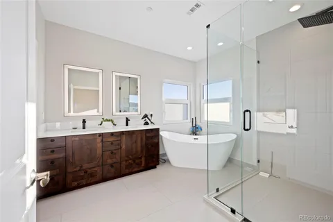 a view of a room with window a ceiling fan and refrigerator
